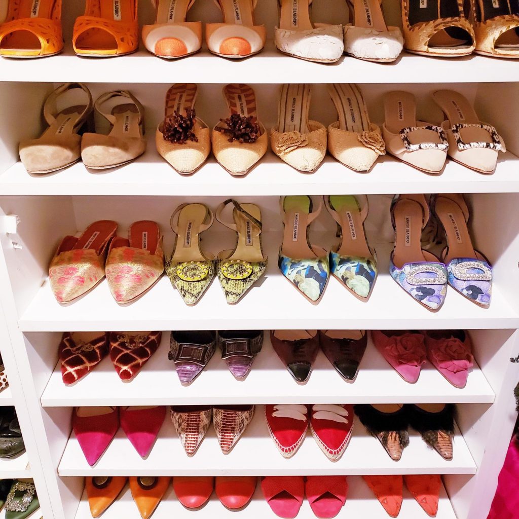 Pretty pumps on a white shelf