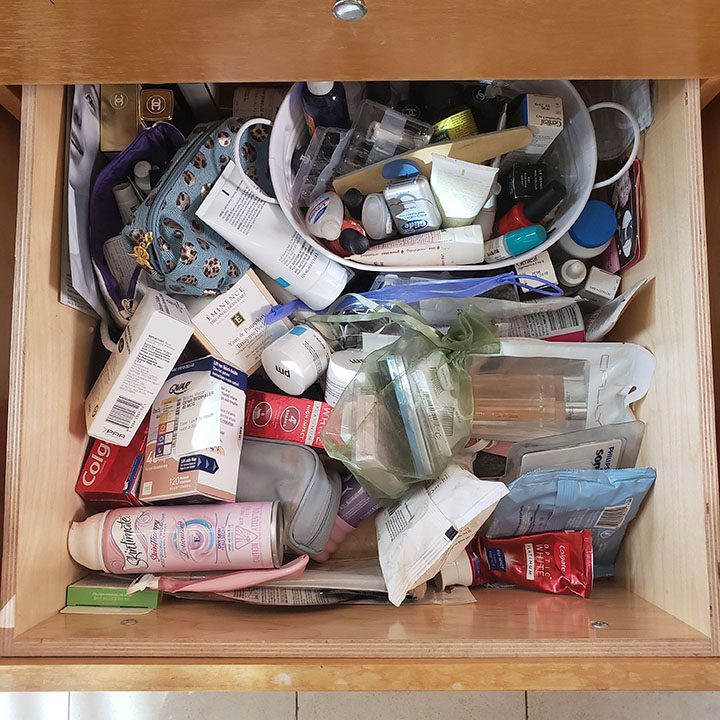 A well-organized drawer filled with cosmetics and toiletries.