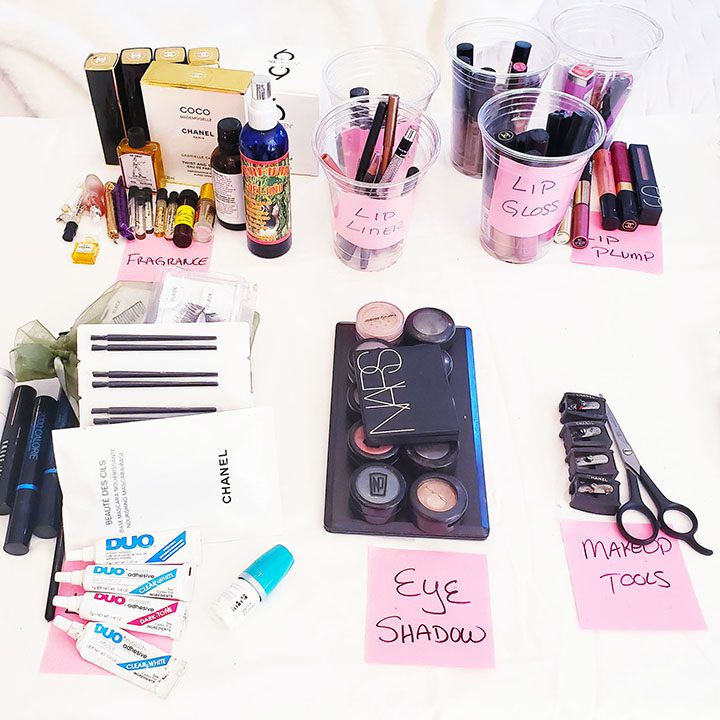 A beautifully arranged table showcasing an array of cosmetics and makeup brushes, providing the perfect inspiration to organize your makeup collection.