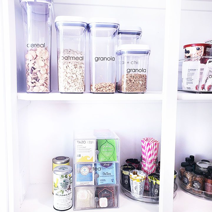 A pantry with a variety of containers and food items.