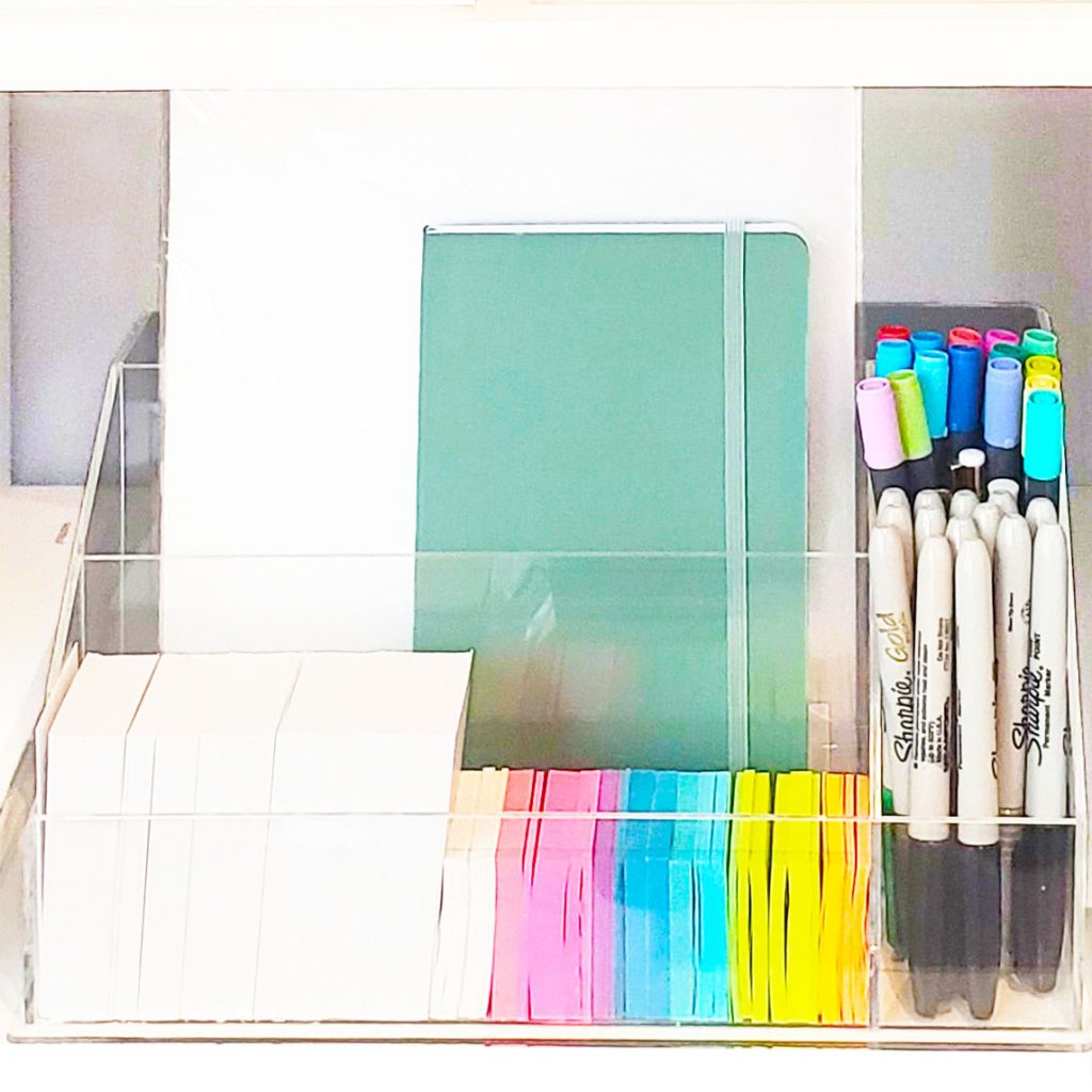 Organize your desktop with a clear holder for pens, markers, and notebooks.