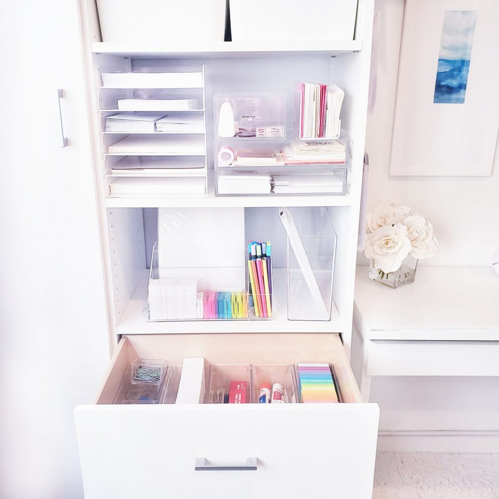 A white filing cabinet filled with a plethora of supplies to help you organize your desktop efficiently.