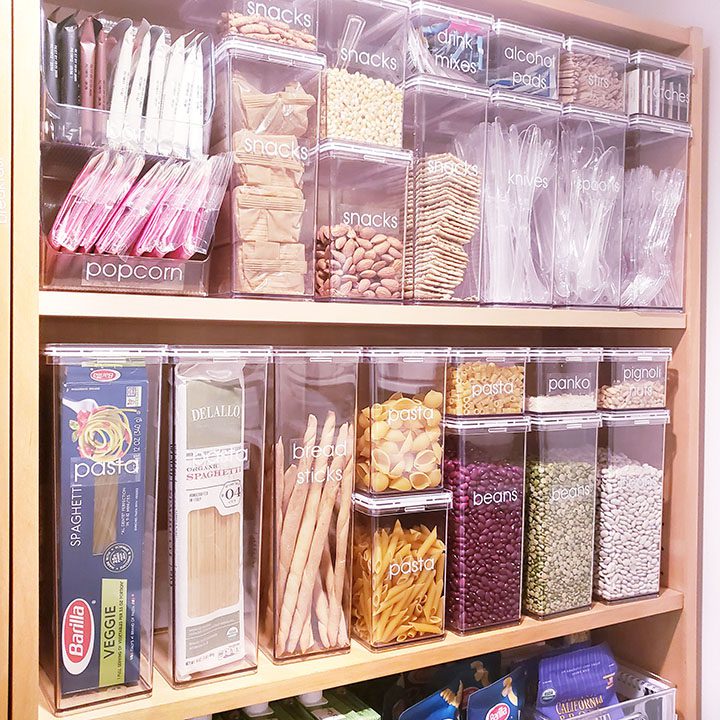 A pantry filled with a lot of different containers filled with food.