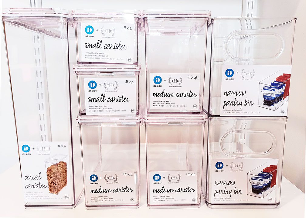 A pantry display of food storage containers with labels on them.