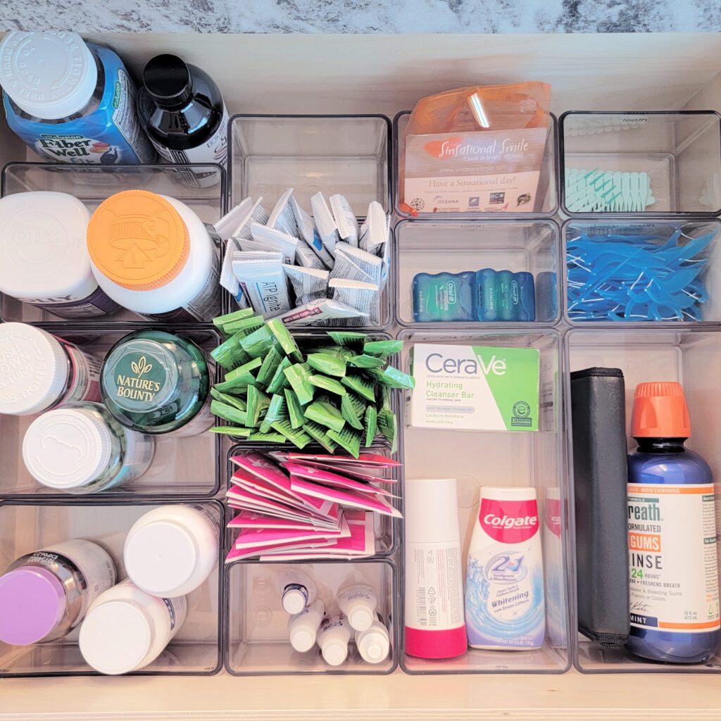 A drawers filled with medicine and other items.