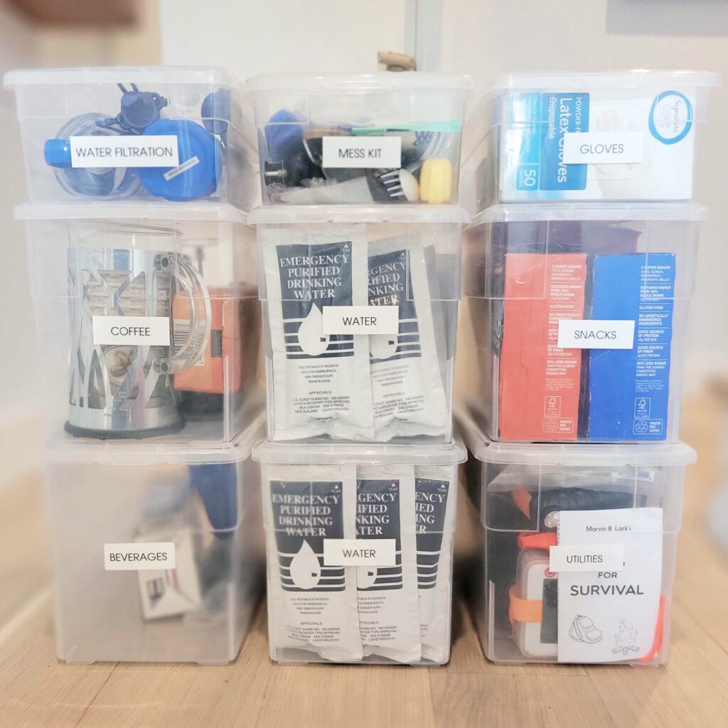 An emergency supply kit contained in a clear plastic container.