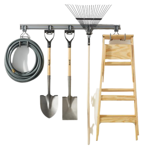 A garden tool rack with a ladder, rake, shovel and other tools.