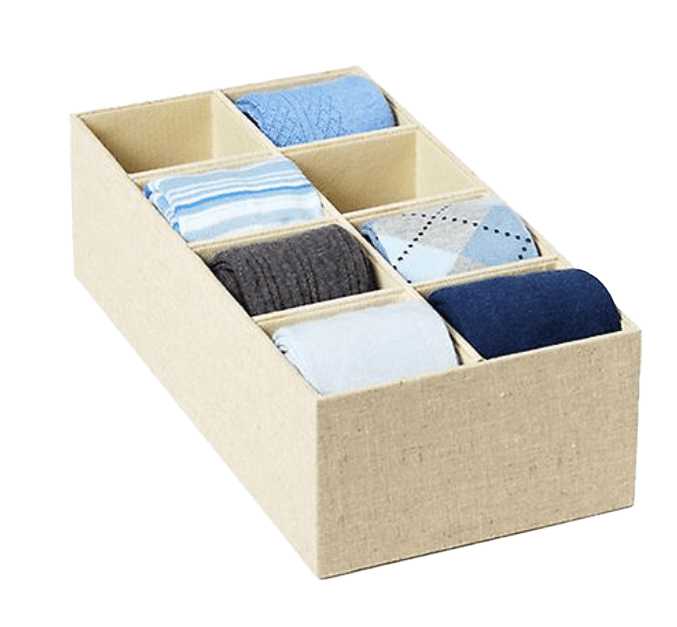 A beige box with six pairs of socks in it.
