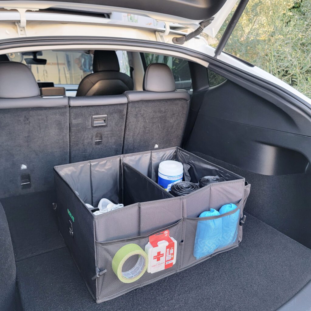 The car's trunk is filled with various items.
