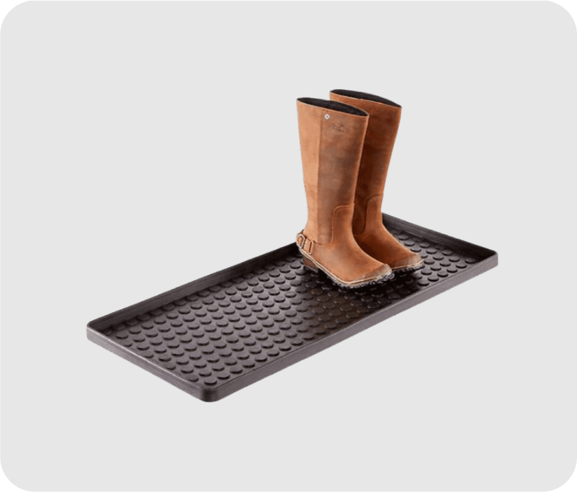 A pair of brown boots on a wardrobe tray.