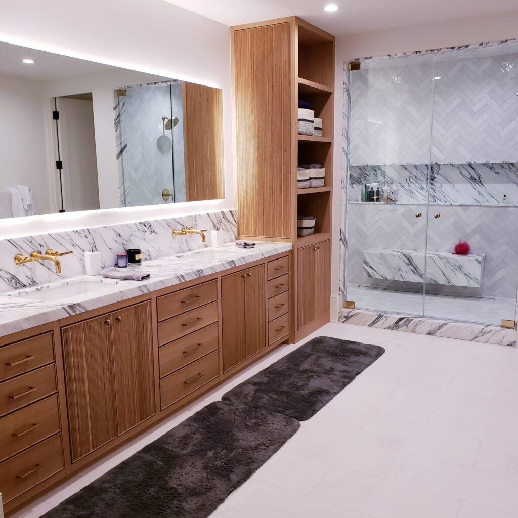 Modern bathroom with marble and wooden accents.