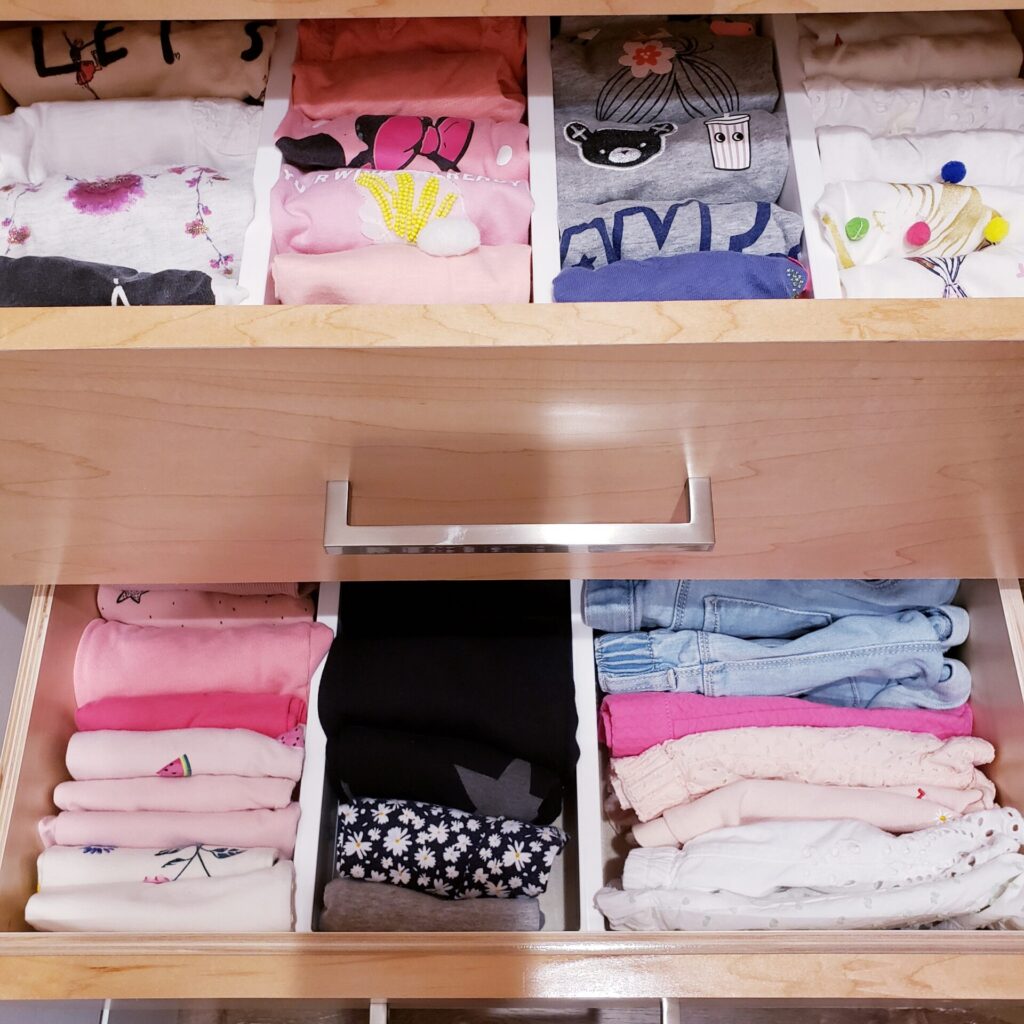 Organized drawer with neatly folded clothes.