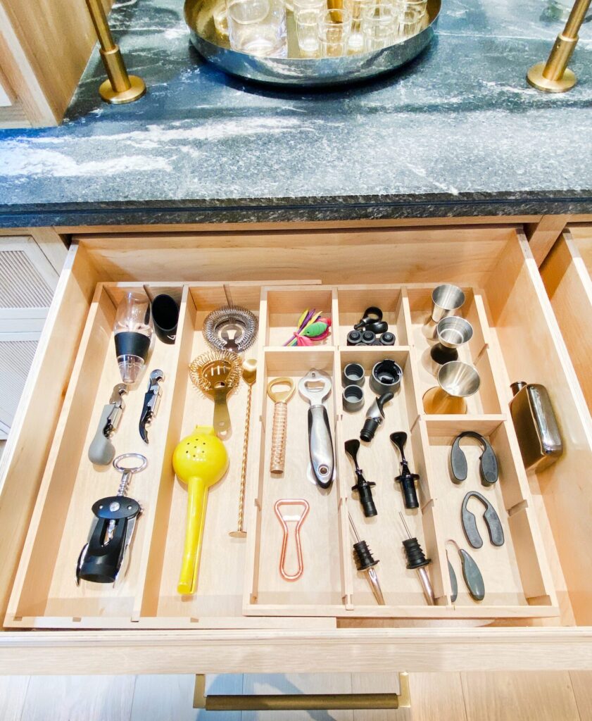 Organized kitchen drawer with various tools.